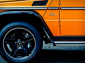 Close-up of Orange Mercedes-AMG G-Class Wheel and Side Detail