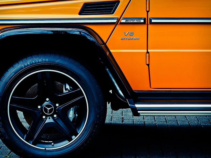 Close-up of Orange Mercedes-AMG G-Class Wheel and Side Detail