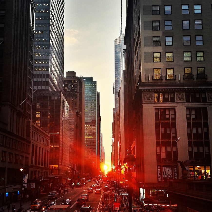 Sunset Cityscape of Manhattan Street with Skyscrapers and Traffic