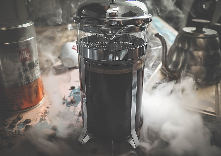 French Press Coffee with Dry Ice Smoke on Rustic Table