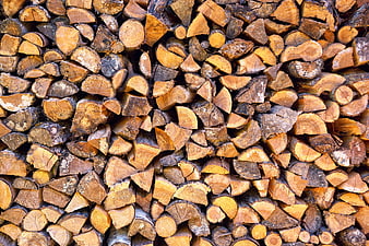 Stack of chopped firewood logs texture background