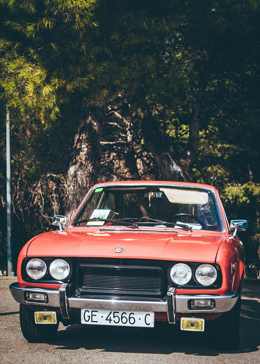 Front view of classic red Fiat 124 Spider vintage car