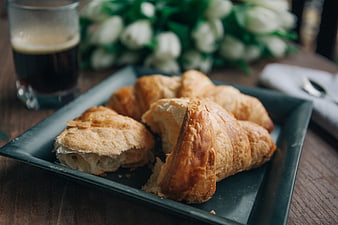 Fresh Croissants and Coffee on Dark Plate