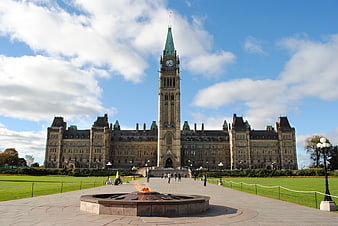 Parliament Hill Ottawa Canada with Peace Tower and National Flag of Canada