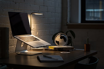 Modern Workspace with Laptop and Desk Lamp