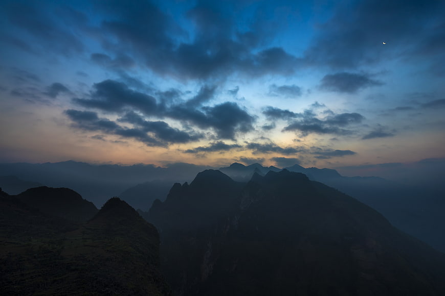 Dramatic Mountain Landscape at Twilight with Cloudy Sky