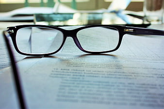 Black Eyeglasses on Document with Shallow Depth of Field