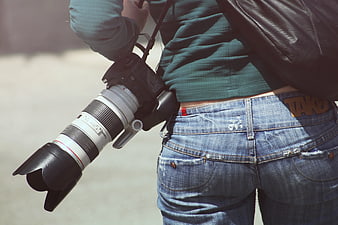 Photographer with DSLR Camera and Leather Jacket