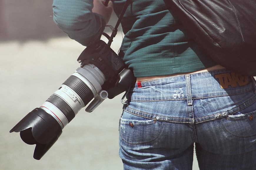 Photographer with DSLR Camera and Leather Jacket