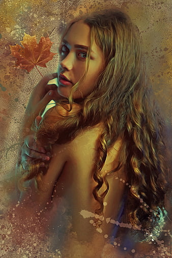 Ethereal autumn fantasy portrait of woman with maple leaf