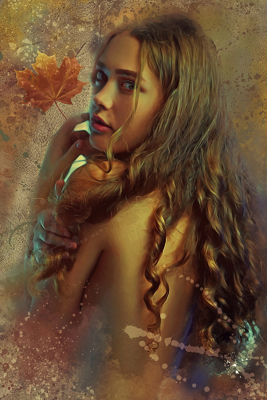 Ethereal autumn fantasy portrait of woman with maple leaf
