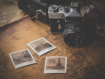 Vintage Zenit Camera and Paris Postcards on Old Map