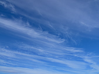 Blue Sky with Wispy Cirrus Clouds Background