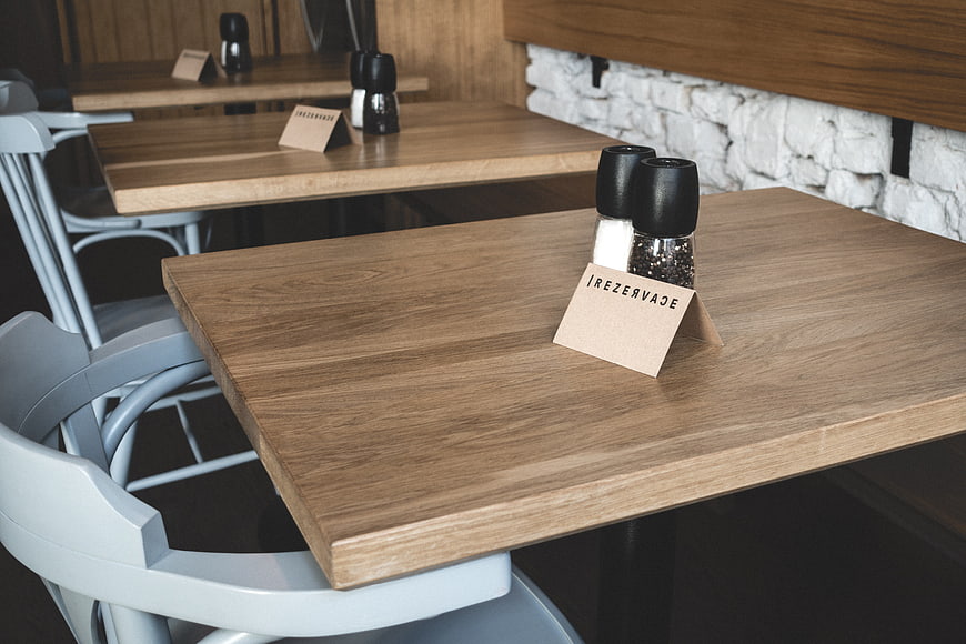 Reserved wooden table in modern restaurant interior