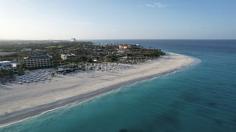 Aerial View of Tropical Beach Resort and Turquoise Ocean