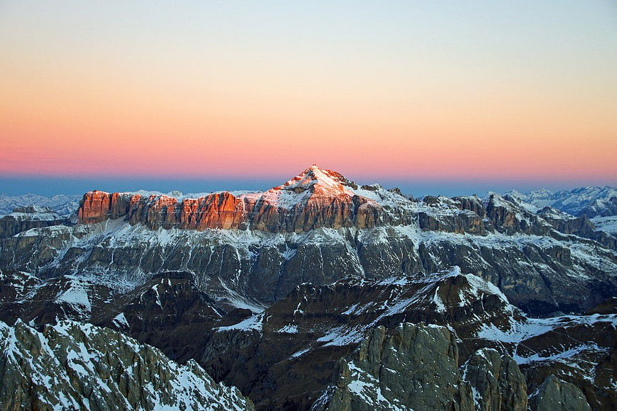 Snowy Mountain Peak at Sunrise with Pink Sky