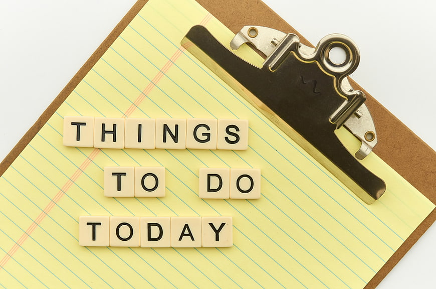 Things to do today letters on yellow clipboard