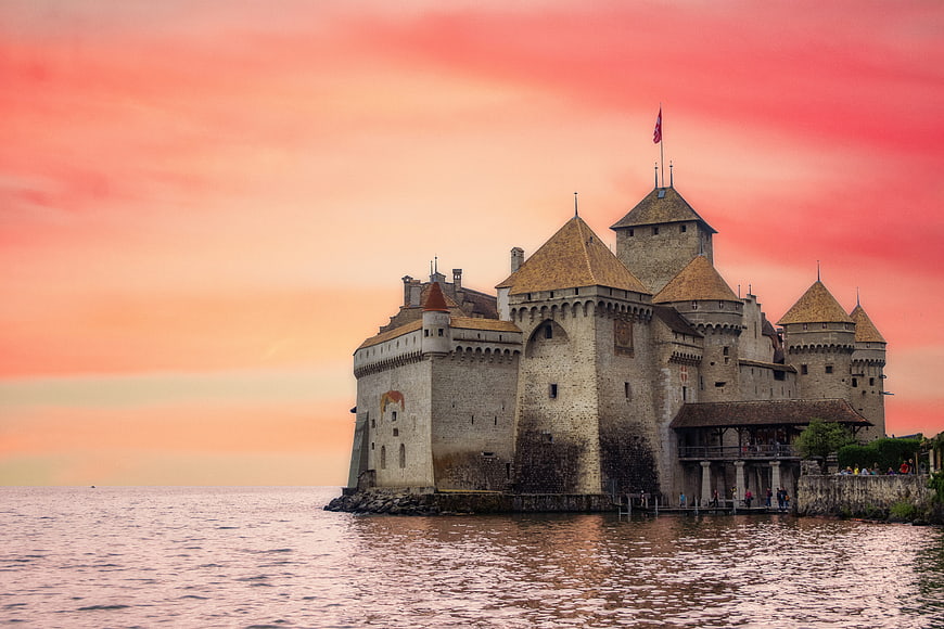 Medieval Castle on Lake Shore at Sunset