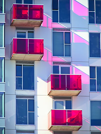Modern Apartment Building with Red Glass Balconies