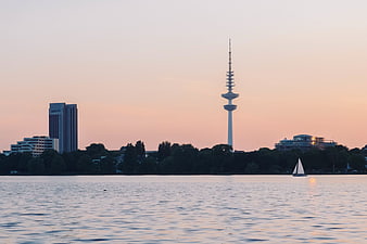 Hamburg TV Tower and Harbor at Sunset with Sailboat