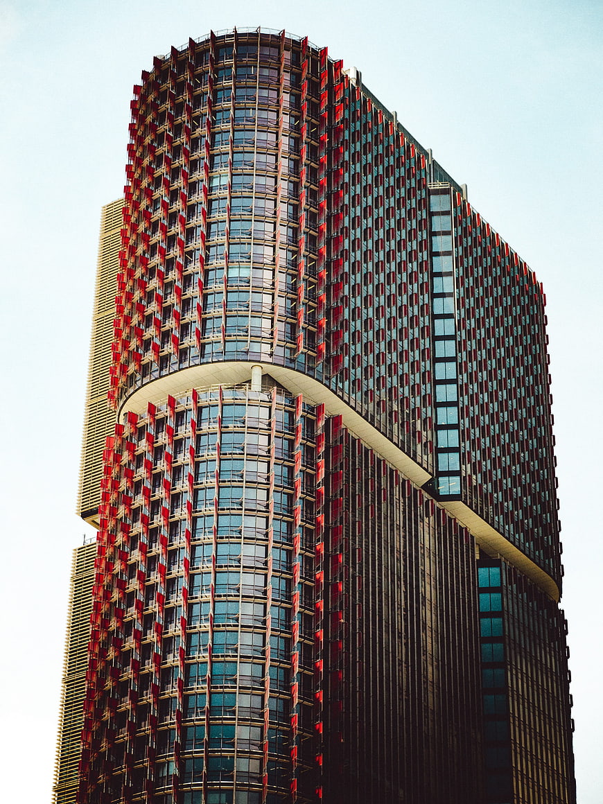 Modern Skyscraper with Red and Blue Facade Details