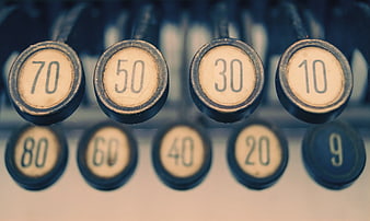 Close-up of vintage adding machine keys with numbers
