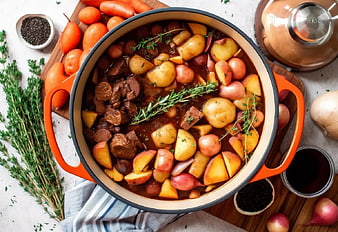 Hearty Beef and Vegetable Stew in Orange Dutch Oven