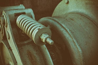 Close-up of old industrial machinery with vintage green and brown tones