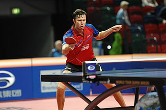 Male Table Tennis Player In Action During Indoor Tournament