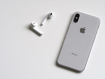White iPhone X and AirPods on Minimal White Background
