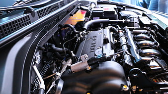 Close-up of car engine bay with DOHC 16V valve cover