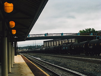Freight train at Altoona rail yard with warm station lights