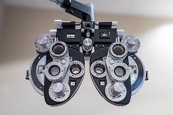 Close-up of a professional phoropter used for eye examinations in an optometry clinic