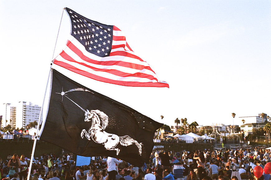 American Flag and Unicorn Flag at Outdoor Festival
