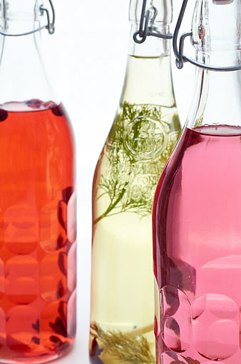 Colorful Infused Liquor Bottles with Herbs
