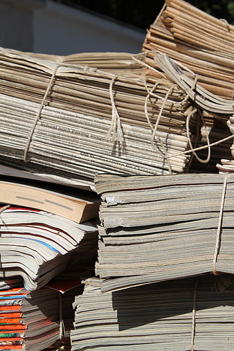 Stacks of bundled old newspapers and magazines for recycling