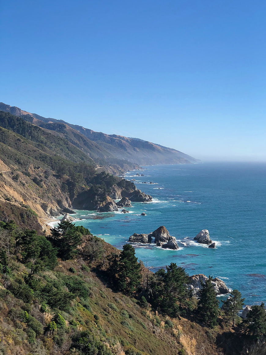 Scenic Big Sur coastline with sea arch and blue ocean