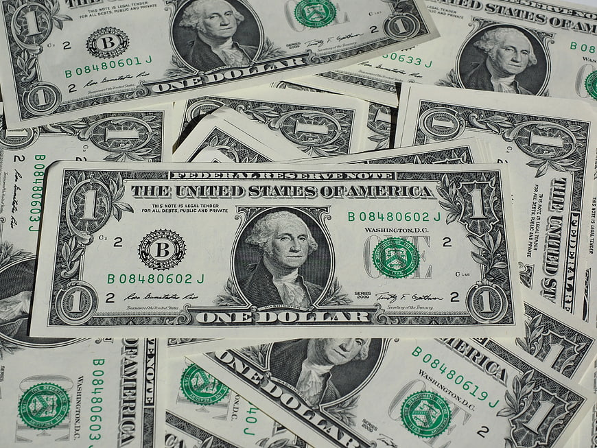 Scattered One Dollar Bills Background