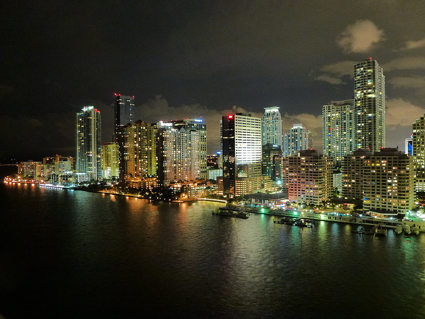 Miami Beach Skyline at Night with City Lights Reflecting on Water