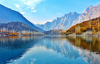 Autumn landscape of Upper Kachura Lake with mountains and reflections