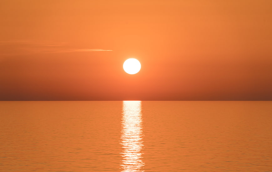 Minimalist Orange Sunrise Over Calm Water