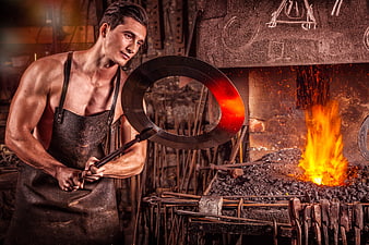 Muscular Blacksmith Holding Glowing Metal Ring in Forge