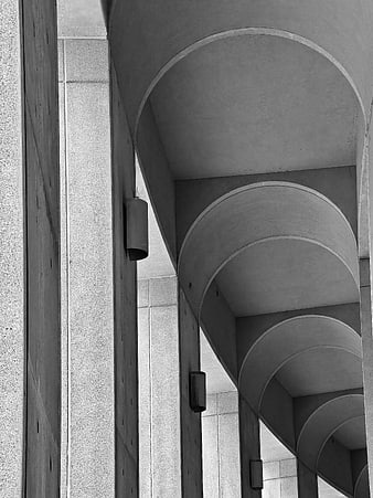 Black and white architectural detail of concrete arches and pillars