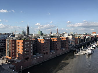 Hamburg City Skyline with Elbe River and Brick Warehouses