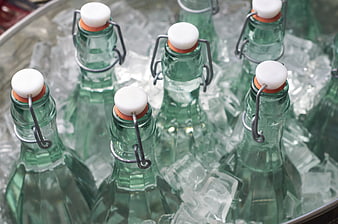 Green Glass Bottles with Swing Tops in Ice Bucket