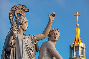 Classical Greek Statue of Athena and Youth Against Blue Sky