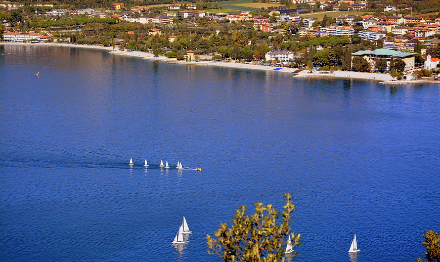 Sailboats on Lake Garda with Town Panorama