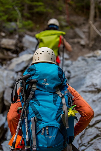 Hikers with Backpacks on Rocky Trail