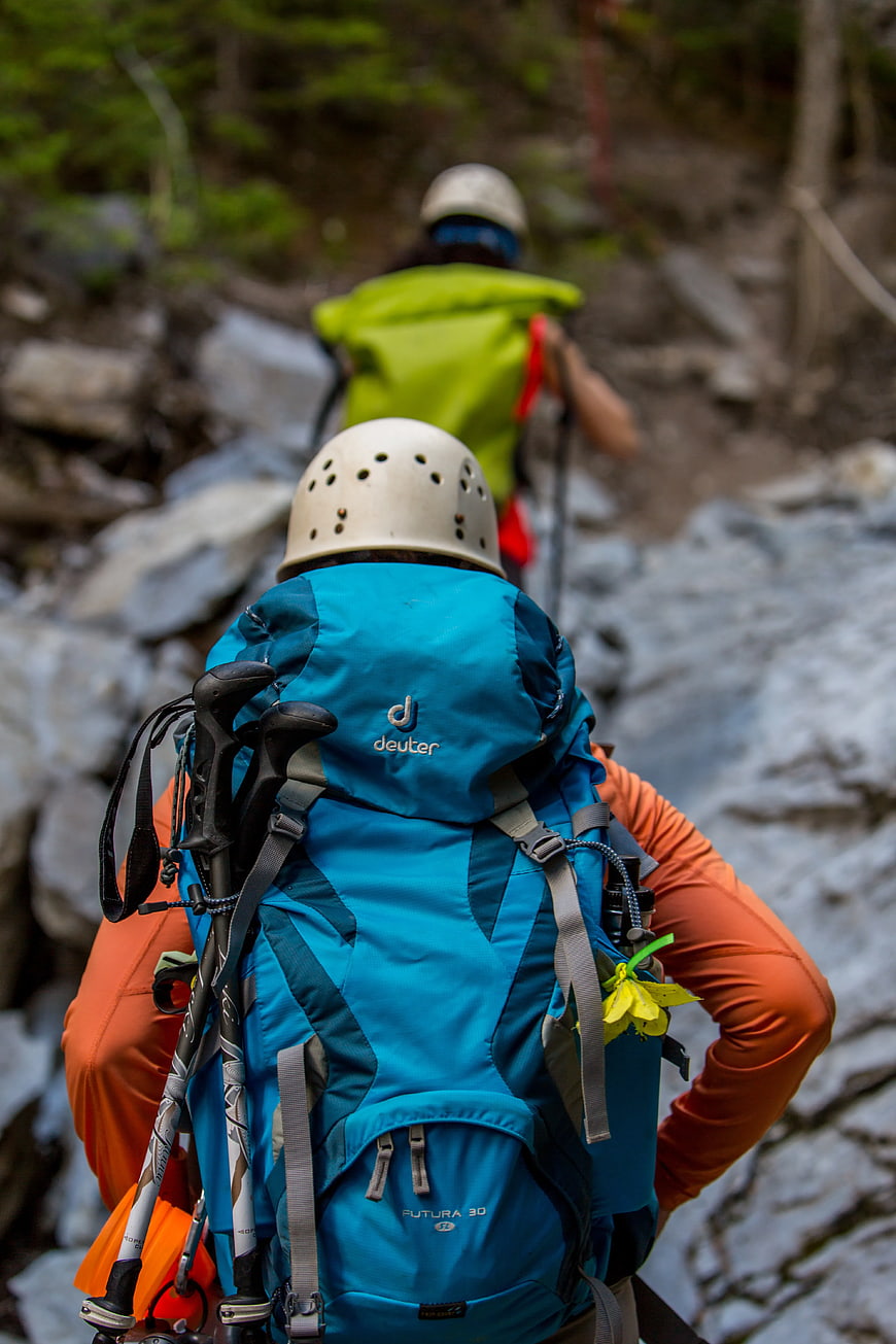 Hikers with Backpacks on Rocky Trail