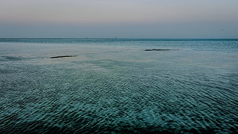 Calm Blue Sea Surface with Gentle Ripples at Dusk